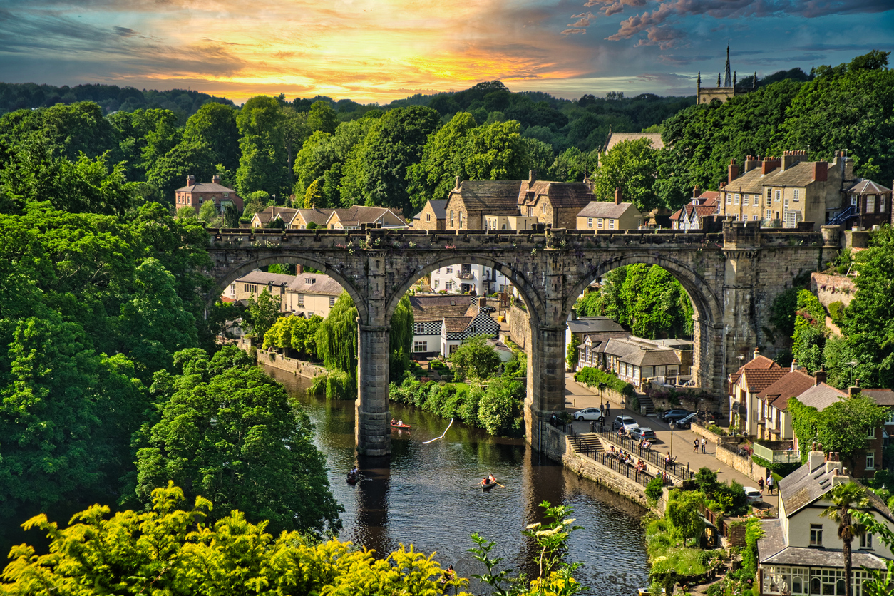 A view of the Viaduct from Knaresborough Castle, North Yorkshire, UK. Summer greenery at sunset.