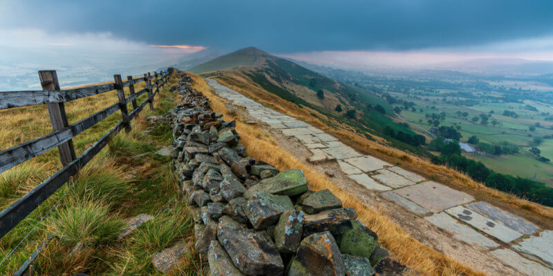 Things to do in Yorkshire: Explore the scenic trails of the Peak District National Park, featuring stunning views of rolling hills, stone paths, and lush valleys, perfect for hiking and outdoor adventures.