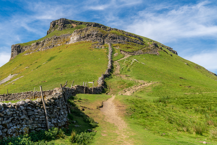 Yorkshire Dales landscape on the Pennine Way between Halton Gill and Horton in Ribblesdale with the Pen-Y-Ghent in the background, North Yorkshire, England, UK