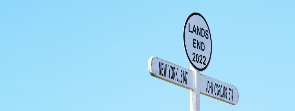 Horizontal banner or header with signpost at Land`s End Cornwall UK. Land's End to John o' Groats is the traversal of the whole length of Great Britain between two extremities - southwest & northeast