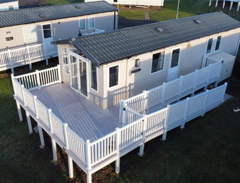 Overhead shot of a static caravan during the day.