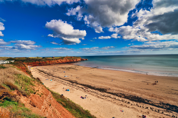 A landscape photograph of Sandy Bay at Exmouth, Devon.