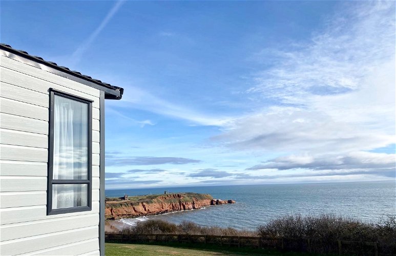 View from the deck of a static caravan in Devon Cliffs Holiday Park, Devon, England.