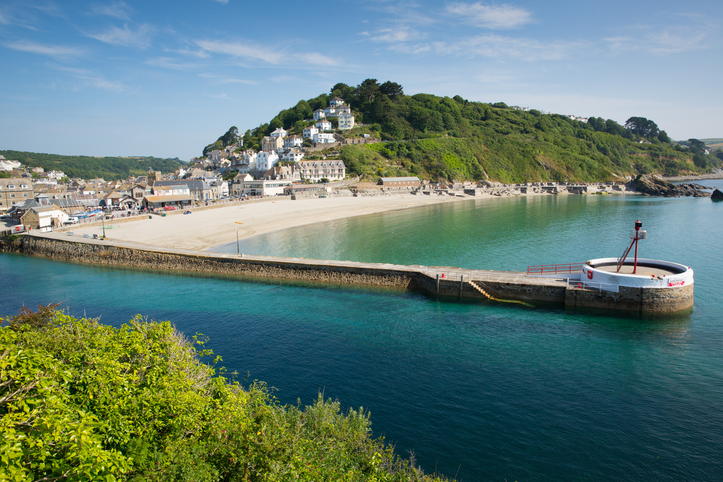 Looe harbour Cornwall England with blue sea on a sunny summer day