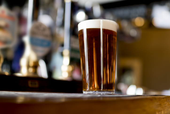 Pint of real ale on the bar in a traditional English pub in the United Kingdom