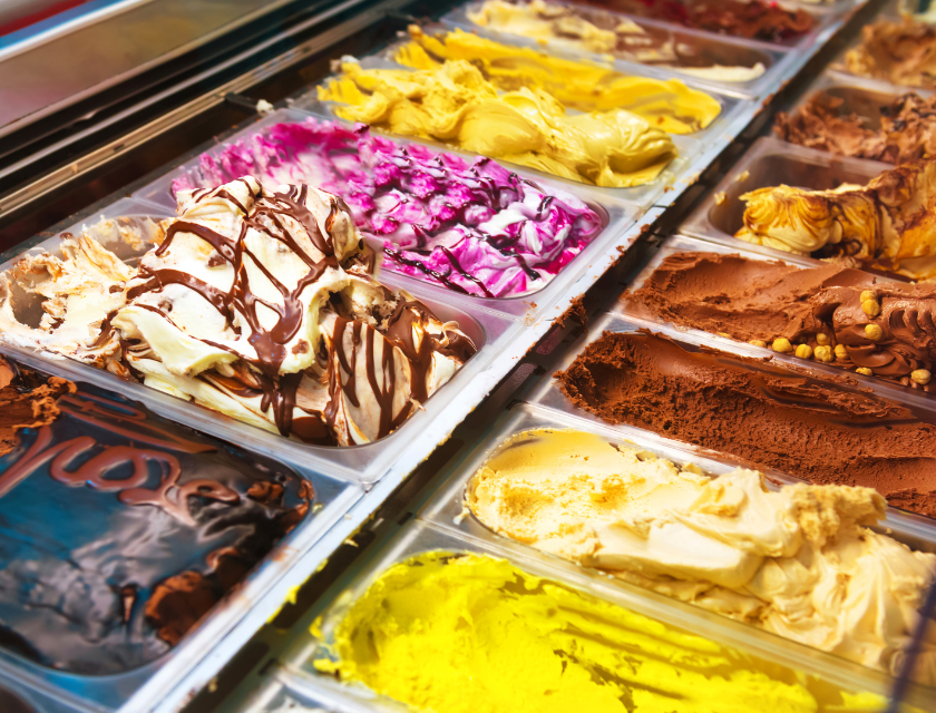 Parisella’s Ice Cream Parlour is a popular attraction near Conwy Morfa Beach. Close up of the counter at an ice cream parlour. Several flavours are visible.  