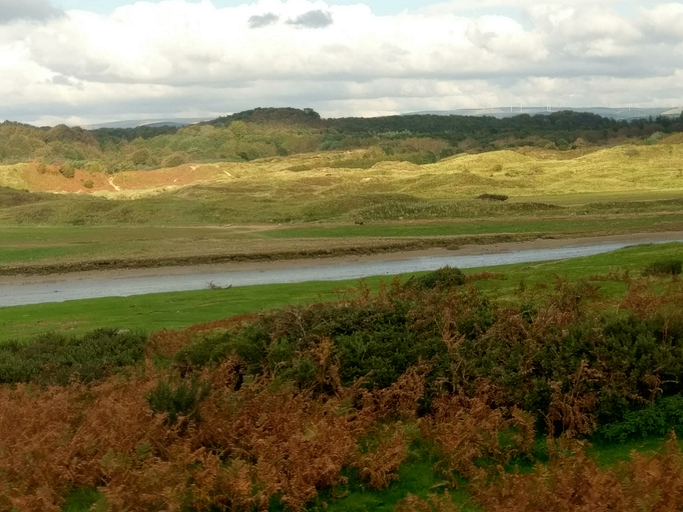 The countryside on both banks of the river Ogmore at Ogmore by sea South Wales UK