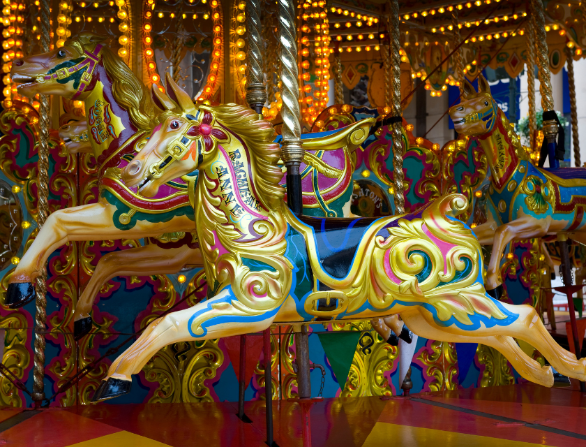 A colorful carousel with detailed horse designs 