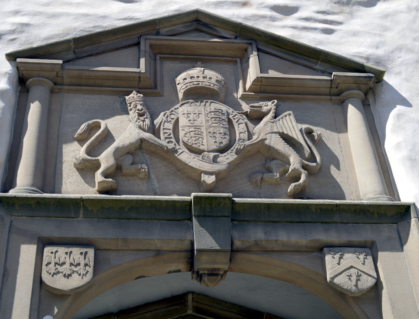 Stone carving of the Royal Coat of Arms displayed the Elizabethan townhouse, Plas Mawr. in Conwy, North Wales.