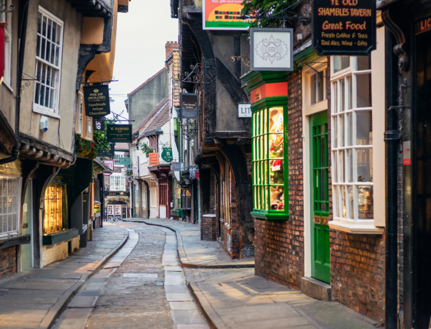 Shambles, York at dusk covered in a festive glow during the Christmas season.
