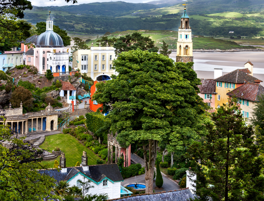 Village in Portmeirion, North Wales surrounded by greenery and pastel buildings, the town prepares for Christmas markets in North Wales.