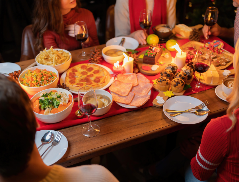 Christmas dinner table full of festive foods and treats. A highlight of UK Christmas Caravan Holidays.